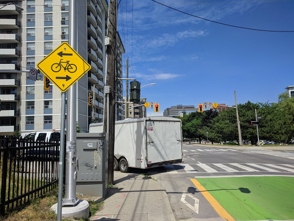 Truck driver turning from Bay bike lanes onto Hunter bike lanes