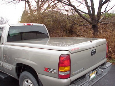 Truck bed cover: Does anything say 'this truck doesn't do real work' better than this accessory? It reduces the utility of a truck bed to that of a car trunk. Why not buy a car? (Image Credit: Auto-Trim)