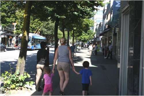 Wide sidewalks with trees and park as buffers make Robson an attractive pedestrian street (especially for children).