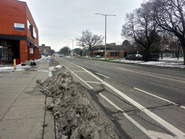 Snow and ice blocking bike lanes on York (Image Credit: Ryan McGreal)